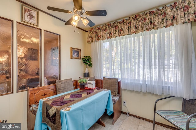 dining space featuring ceiling fan and light tile patterned floors