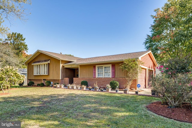 view of front of property with a front lawn and a garage