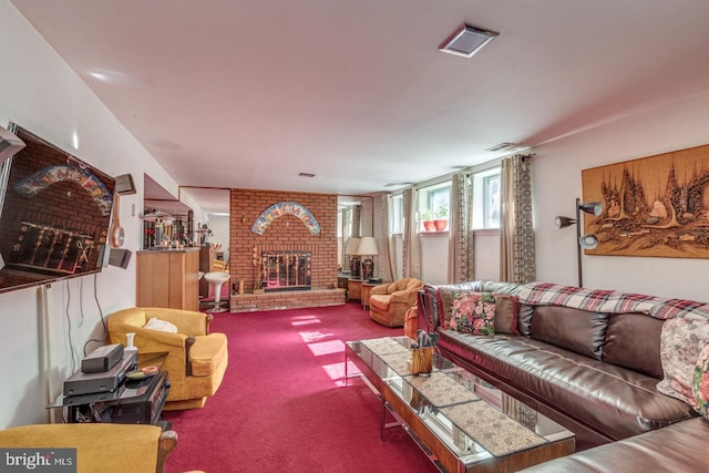 living room with carpet flooring and a brick fireplace