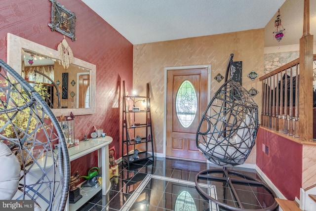 entryway featuring a textured ceiling