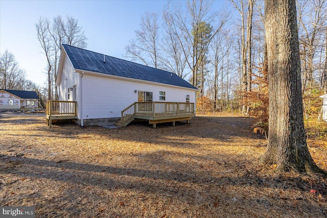 back of property featuring a deck