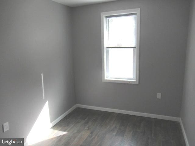 empty room featuring dark hardwood / wood-style floors