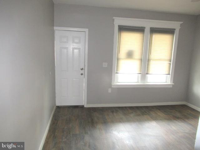 entrance foyer with dark hardwood / wood-style flooring