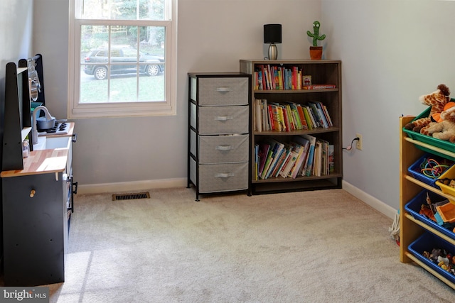 misc room with light colored carpet