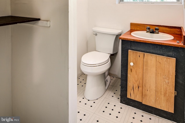 bathroom featuring vanity, toilet, and tile patterned floors