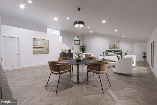 dining room with light parquet floors and vaulted ceiling