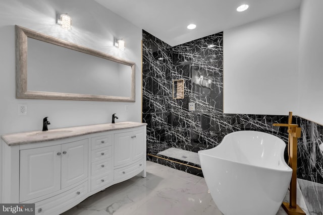 bathroom featuring tile walls, vanity, and independent shower and bath