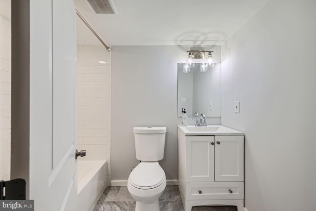 full bathroom with tiled shower / bath, vanity, and toilet