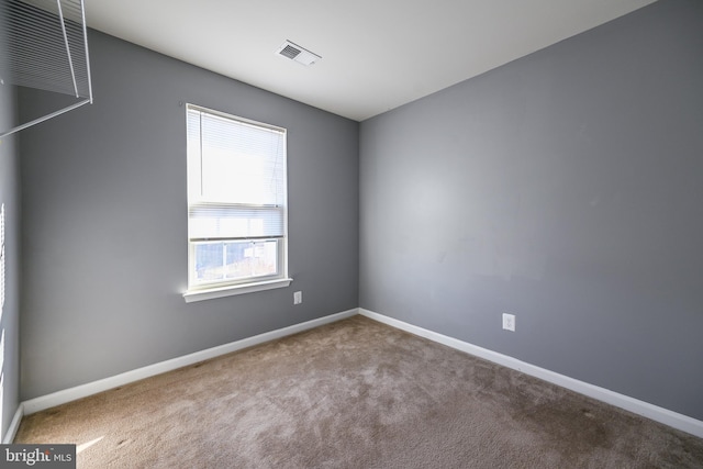 unfurnished room with carpet