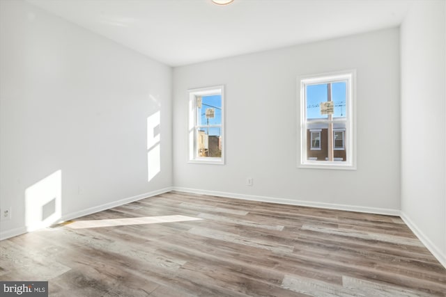 spare room featuring light hardwood / wood-style flooring