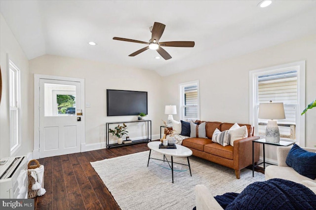 living room featuring wood-type flooring, lofted ceiling, and ceiling fan