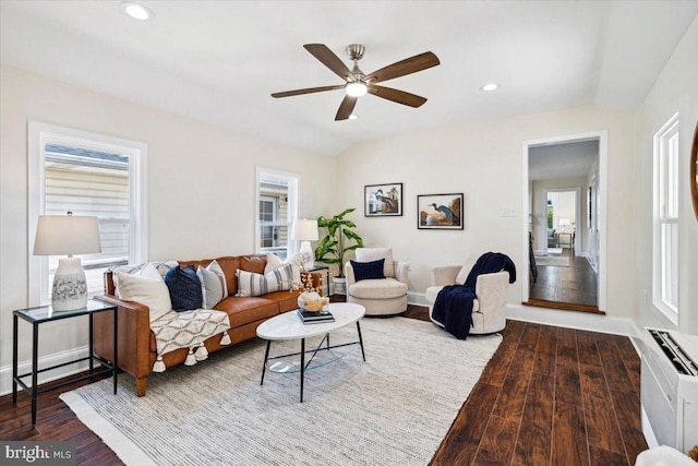 living room with wood-type flooring and ceiling fan