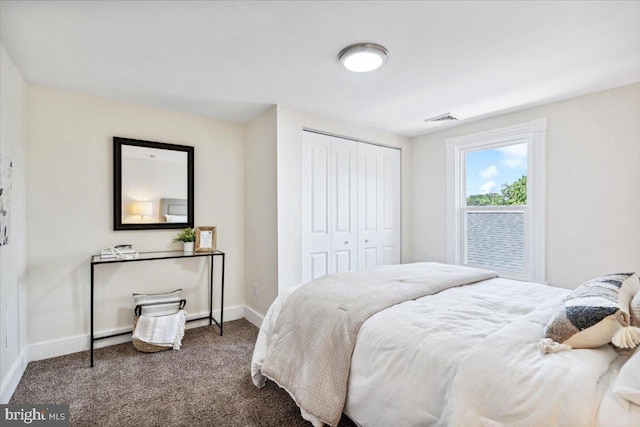 bedroom featuring carpet and a closet