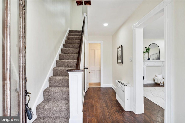 stairs with hardwood / wood-style flooring