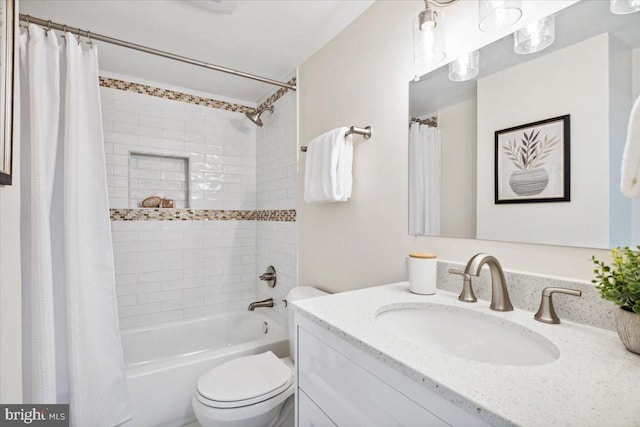 full bathroom featuring vanity, toilet, and shower / bathtub combination with curtain