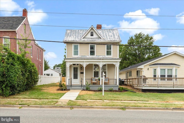 view of front facade with a porch and a front yard