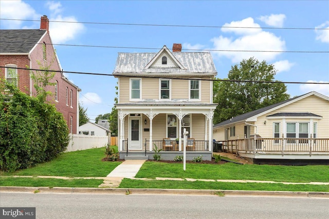 view of front of house with a front lawn and covered porch