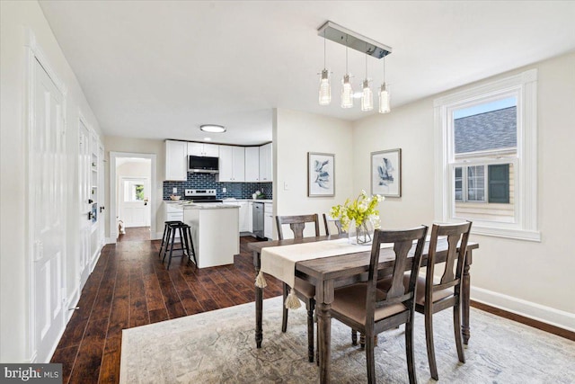 dining area featuring dark hardwood / wood-style floors