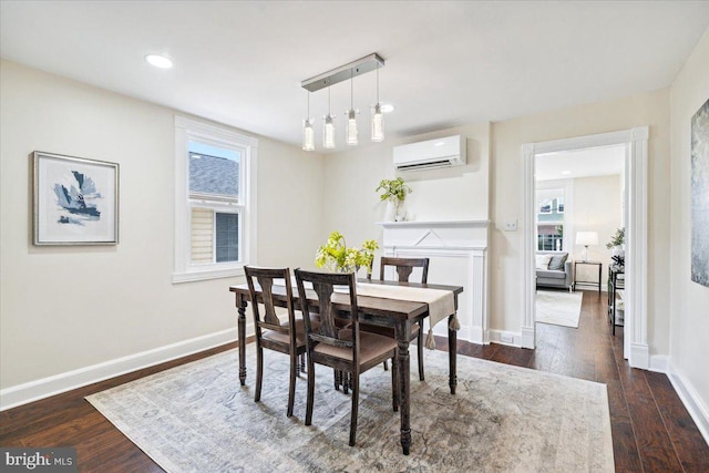 dining space featuring dark hardwood / wood-style floors and a wall mounted AC