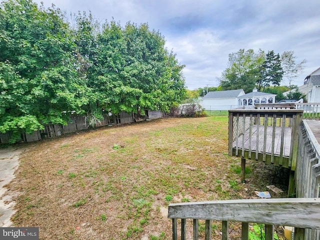 view of yard featuring a wooden deck