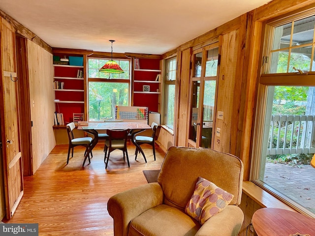 dining room with a wealth of natural light and light hardwood / wood-style flooring