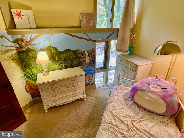 bedroom with multiple windows and carpet flooring