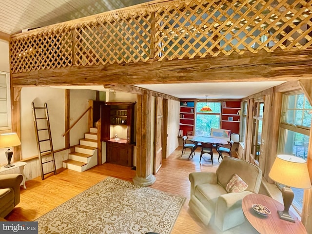 living room featuring a wealth of natural light and light hardwood / wood-style flooring