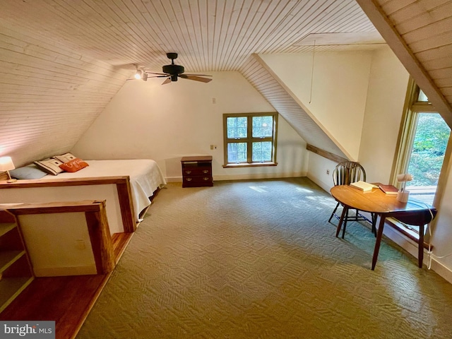 unfurnished bedroom with carpet flooring, wood ceiling, and vaulted ceiling