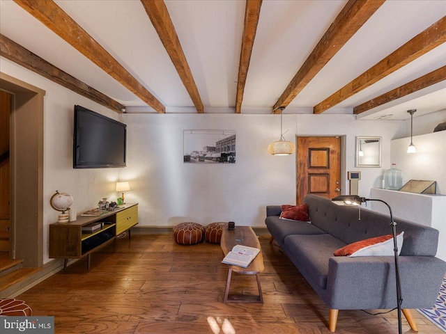 living room with dark hardwood / wood-style flooring and beamed ceiling