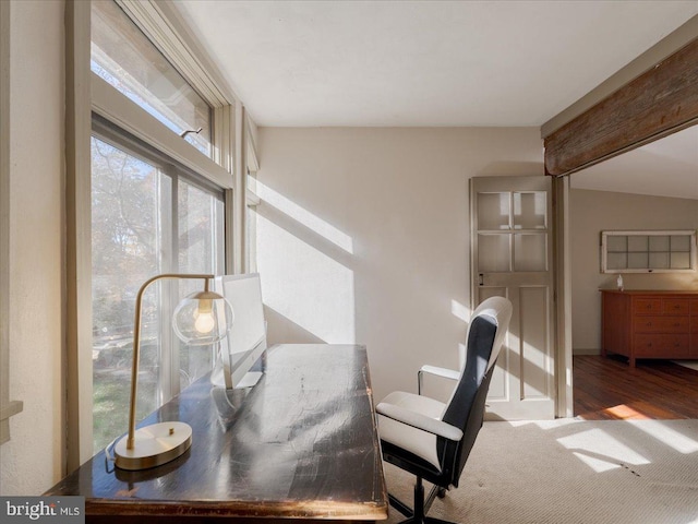 office area with wood-type flooring and vaulted ceiling