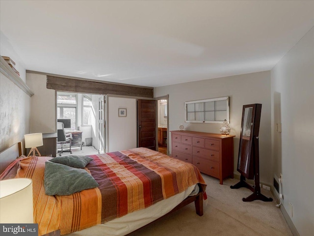 bedroom featuring light colored carpet