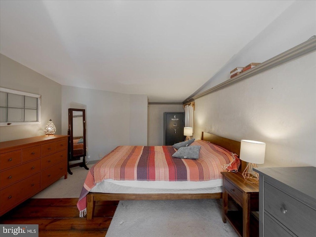 bedroom featuring carpet floors and lofted ceiling