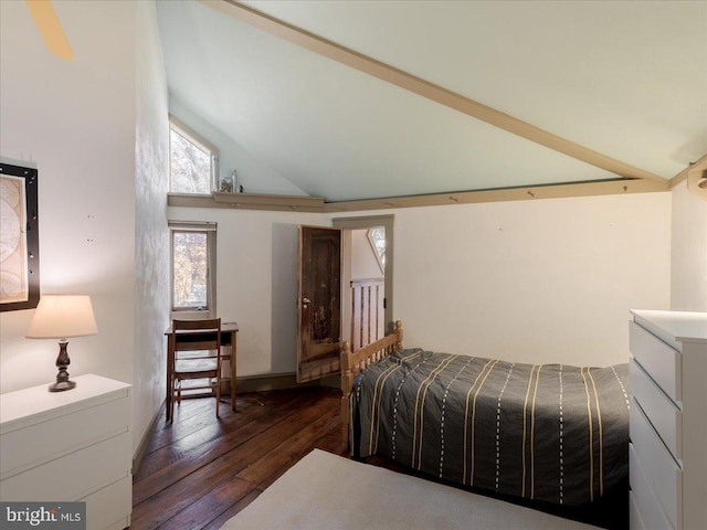 bedroom with high vaulted ceiling and dark hardwood / wood-style floors