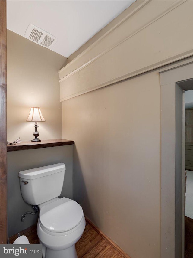 bathroom featuring toilet and hardwood / wood-style floors