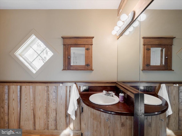 bathroom featuring a skylight and vanity