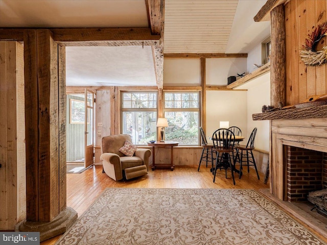 living area featuring light hardwood / wood-style floors and lofted ceiling