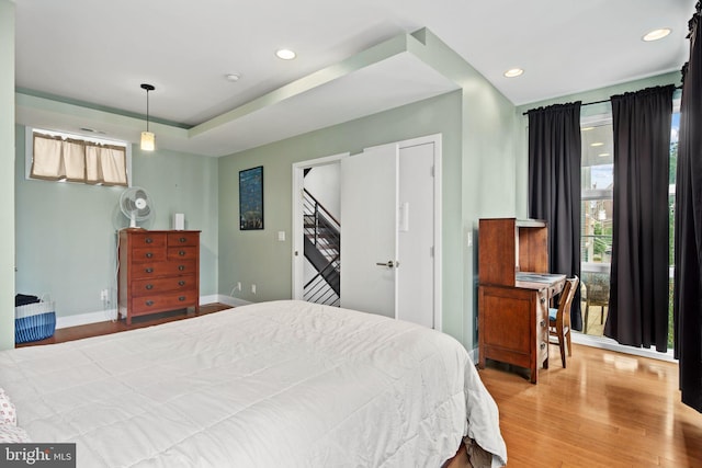 bedroom with light hardwood / wood-style floors