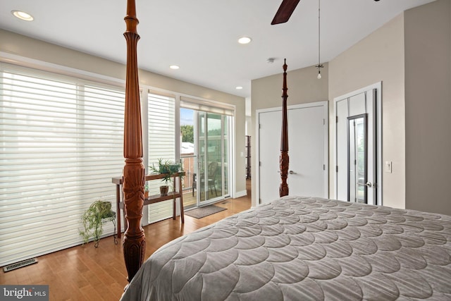 bedroom featuring hardwood / wood-style flooring, ceiling fan, and access to outside