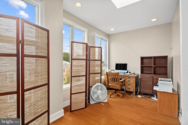 office space with light hardwood / wood-style floors