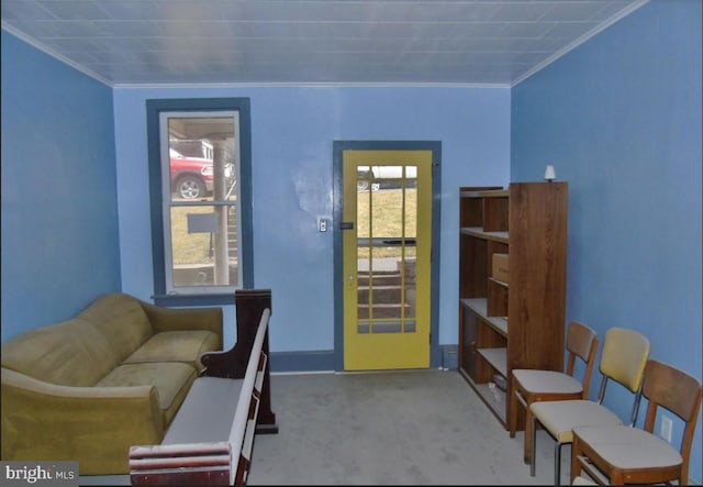 office area with a healthy amount of sunlight, crown molding, and light colored carpet