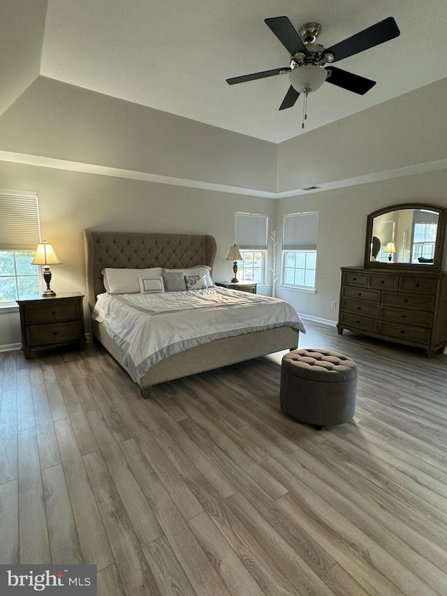 bedroom with light wood-type flooring and ceiling fan