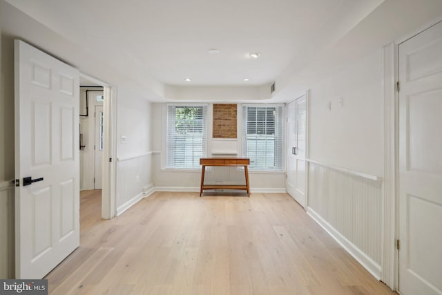 hallway with light wood-type flooring