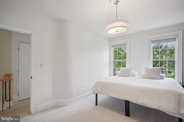 bedroom with light hardwood / wood-style floors