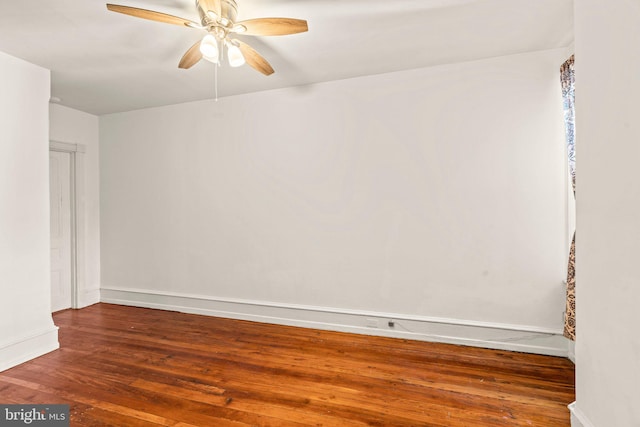 unfurnished room with hardwood / wood-style floors and ceiling fan