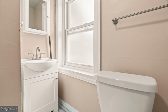 bathroom with toilet and vanity