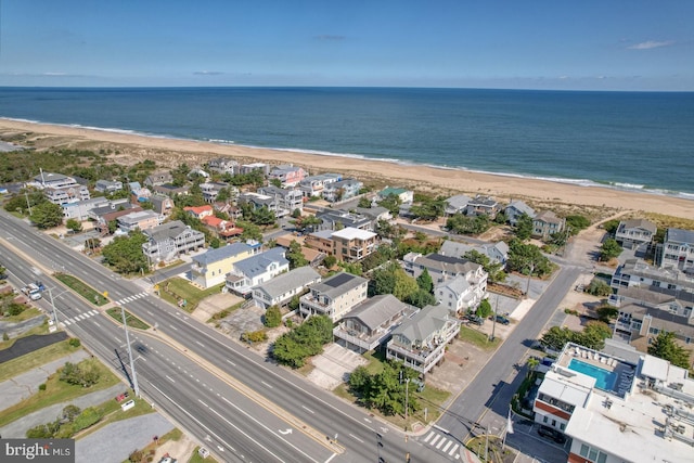 aerial view featuring a water view and a view of the beach