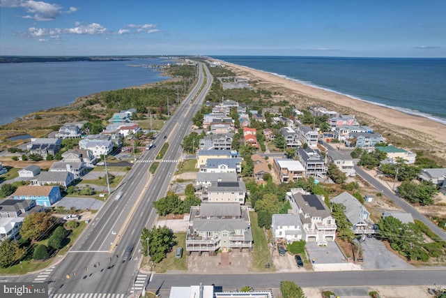 drone / aerial view with a view of the beach and a water view