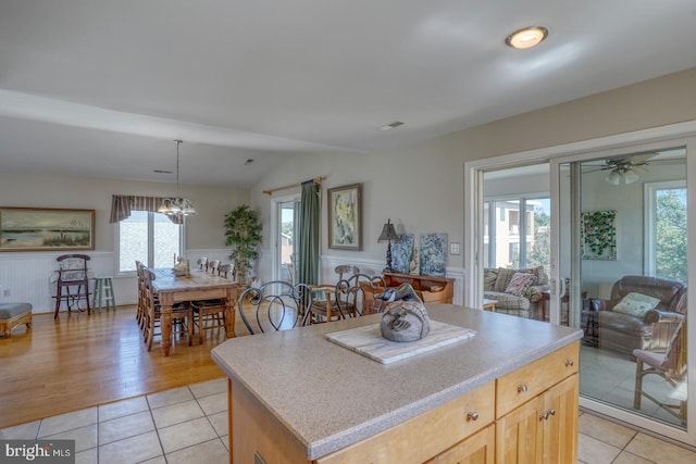 kitchen featuring light brown cabinets, plenty of natural light, and light hardwood / wood-style floors