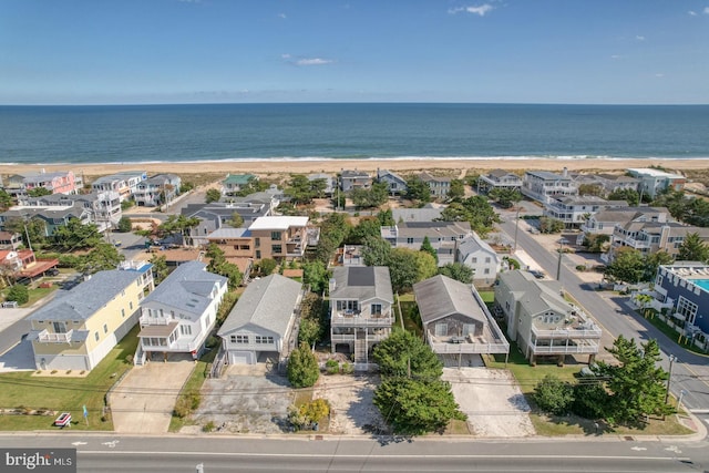 bird's eye view with a view of the beach and a water view