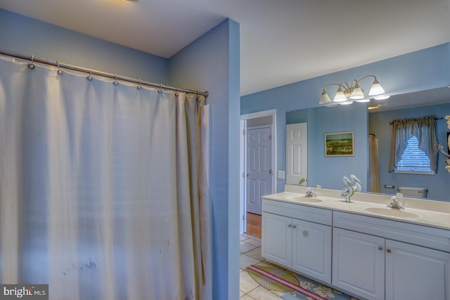 bathroom with tile patterned floors and vanity